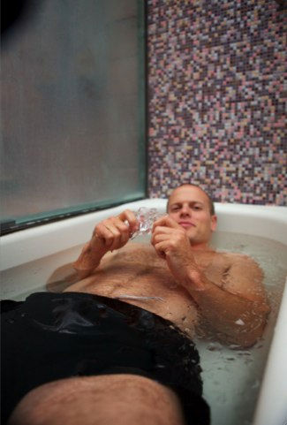 tim laying in tub